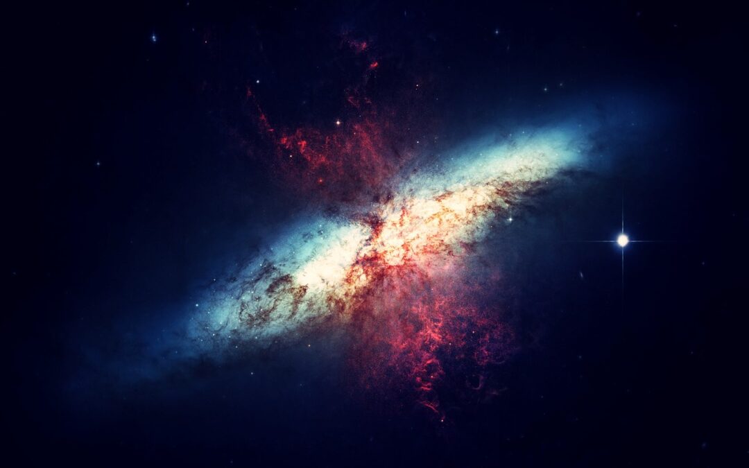 Beautiful crossover of two spiral galaxies, one white, the other red.